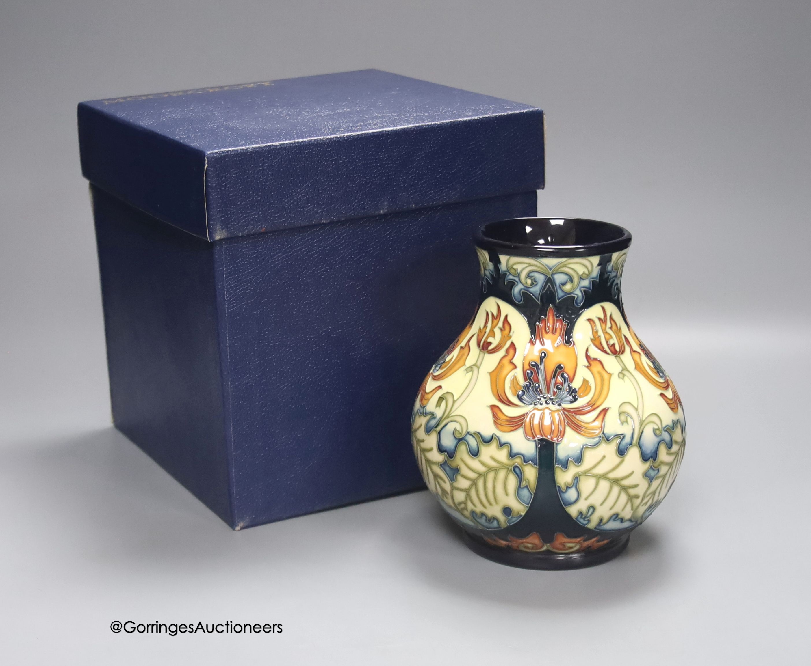 A boxed limited edition Moorcroft pottery vase in the Festive Flame pattern, designed by Kerry Goodwin, painted by Paul Hilditch, signed and numbered 7/100, height 16cm
